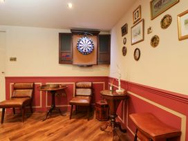 A snug with dartboard and seating at White House