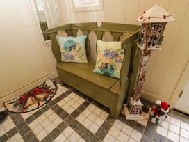 An entryway with a bench and decorative items at White House