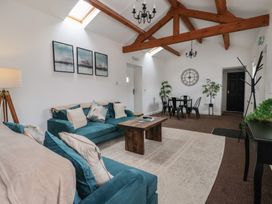 A living room with a sofa and table at Gannet in Flamborough