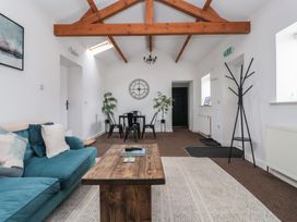 A living room with a sofa and coffee table at Gannet in Flamborough