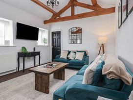 A living room with a sofa and coffee table at Gannet in Flamborough