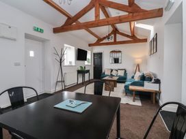 A living room with a sofa and coffee table at Gannet in Flamborough