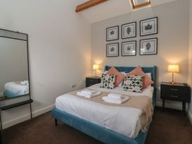 A bedroom with a bed and furniture at Gannet in Flamborough