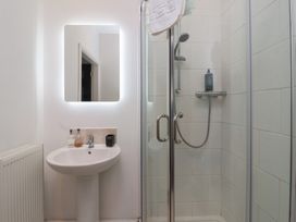 A bathroom featuring a shower and sink at Gannet in Flamborough