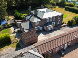 An aerial view of a house with surrounding garden and outbuildings at Gannet in Flamborough