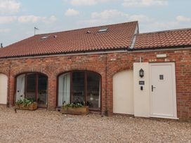 A building with windows and a door at Razorbill in Flamborough