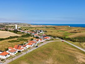 An aerial view of houses and a golf course near Flamborough Guillemot