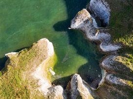 An aerial view of cliffs and ocean at Guillemot in Flamborough