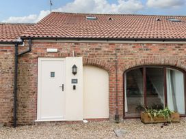 An exterior view of a building with a door and window at Kittiwake Flamborough