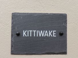 A nameplate with Kittiwake displayed on a slate at Kittiwake in Flamborough