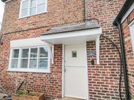 An entrance with a front door and a planter at The Pheasantry in Flamborough