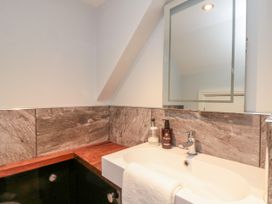 A bathroom with a sink and mirror at The Pheasantry in Flamborough