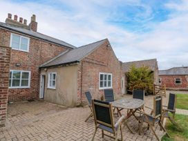 An outdoor seating area in a backyard at The Pheasantry in Flamborough