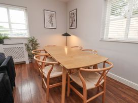A dining room with a table and chairs at The Pheasantry in Flamborough