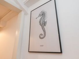 A seahorse illustration in a frame at The Pheasantry in Flamborough