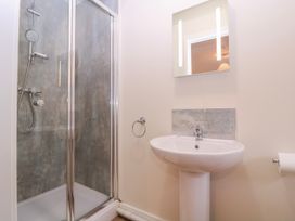 A bathroom with a shower and sink at Country Cottage in Brecon