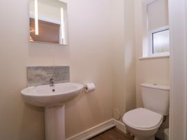 A bathroom with a sink and toilet at Country Cottage in Brecon