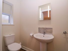 A bathroom with toilet and sink at Country Cottage in Brecon