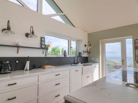 A kitchen with a sink and countertop at 13 Downside Close in Charmouth