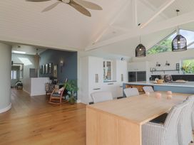 A dining room with a table and chairs at 13 Downside Close in Charmouth