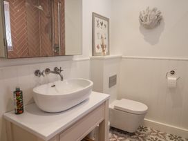A bathroom with a sink and toilet at 13 Downside Close in Charmouth