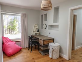 A home office with a desk and chair at 13 Downside Close, Charmouth