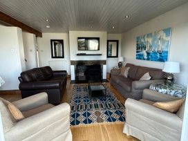 A living room with sofas and a coffee table at Firm Anchor in Salcombe