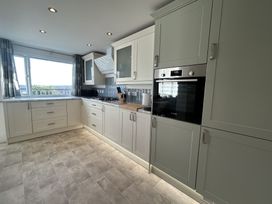 A kitchen with cabinets and countertop at Firm Anchor in Salcombe