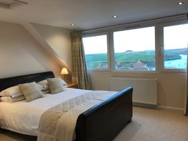 A bedroom with a bed and a window view at Firm Anchor in Salcombe