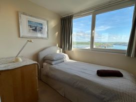 A bedroom with a single bed and a view at Firm Anchor in Salcombe