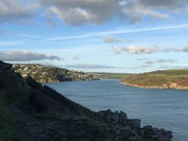 A view of a river with hills and houses at Firm Anchor in Salcombe