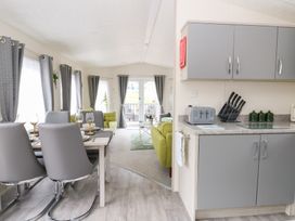 A dining area with table and chairs at The Haven