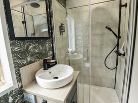 A bathroom with a sink and shower at Heather William Lodge near Woodhall Spa
