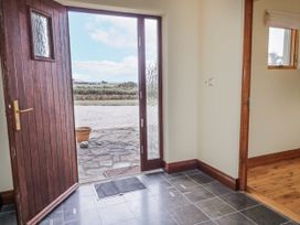 An entrance hall with a door and doormat at Cashelrehine Falcarrheh