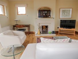 A living room with furniture and a fireplace at Cashelrehine in Falcarrheh