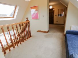 A hallway with stairs and a window at Cashelrehine in Falcarrheh