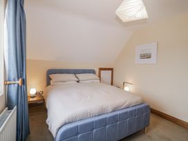 A bedroom with a bed and bedside table at Cashelrehine in Falcarrheh