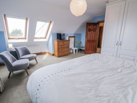 A bedroom with a bed and dresser at Cashelrehine in Falcarrheh