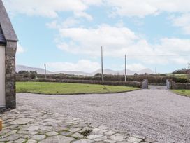 An outdoor view featuring a gravel driveway and grass area at Cashelrehine in Falcarrheh
