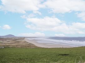 A coastal view with sand and sea at Cashelrehine in Falcarrheh