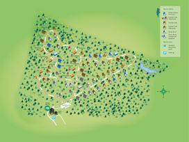 A site map showing cabins of different types in a forest area with roads parking waste points and a lake at Delamere Forest White Willow Premium in Delamere Forest