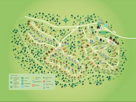 A detailed site map of Forest Retreat showing numbered cabins and treehouses with paths parking and facilities at Forest of Dean Woodland - Golden Oak Treehouse in Forest Of Dean