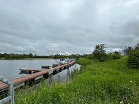 A dock with a boat at 30 River Run in Belturbet