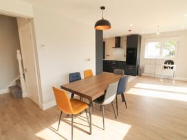 A dining room with a table and chairs at 30 River Run, Belturbet, County Cavan
