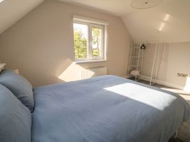 A bedroom with a bed and shelves at 30 River Run, Belturbet, County Cavan