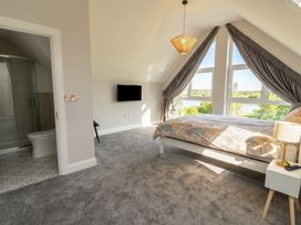 A bedroom with a bed and television at 30 River Run, Belturbet, County Cavan