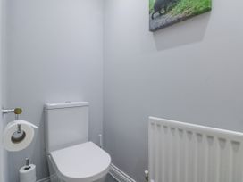 A small bathroom with a toilet radiator and toilet paper at 48 Aysgarth Rise in Bridlington