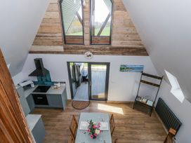 A kitchen with a dining table and chairs at Valley View Hideaway Ffostrasol