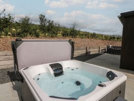 A hot tub in an outdoor area at Rydlan Aberystwyth