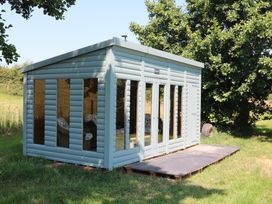 A shed with glass windows in a garden at Holmside Audley Brow near Market Drayton